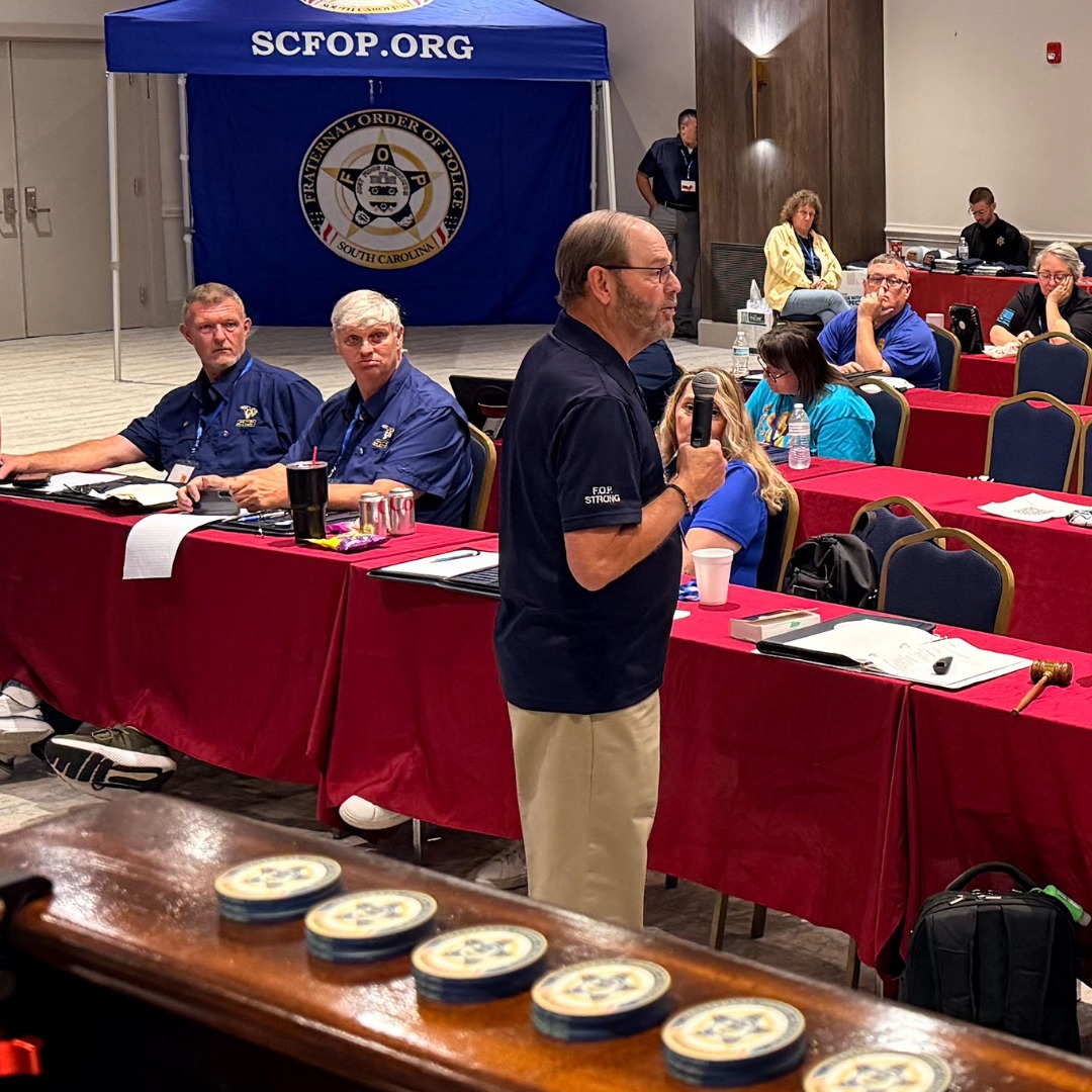 An instructor speaking with participants during lodge leadership training